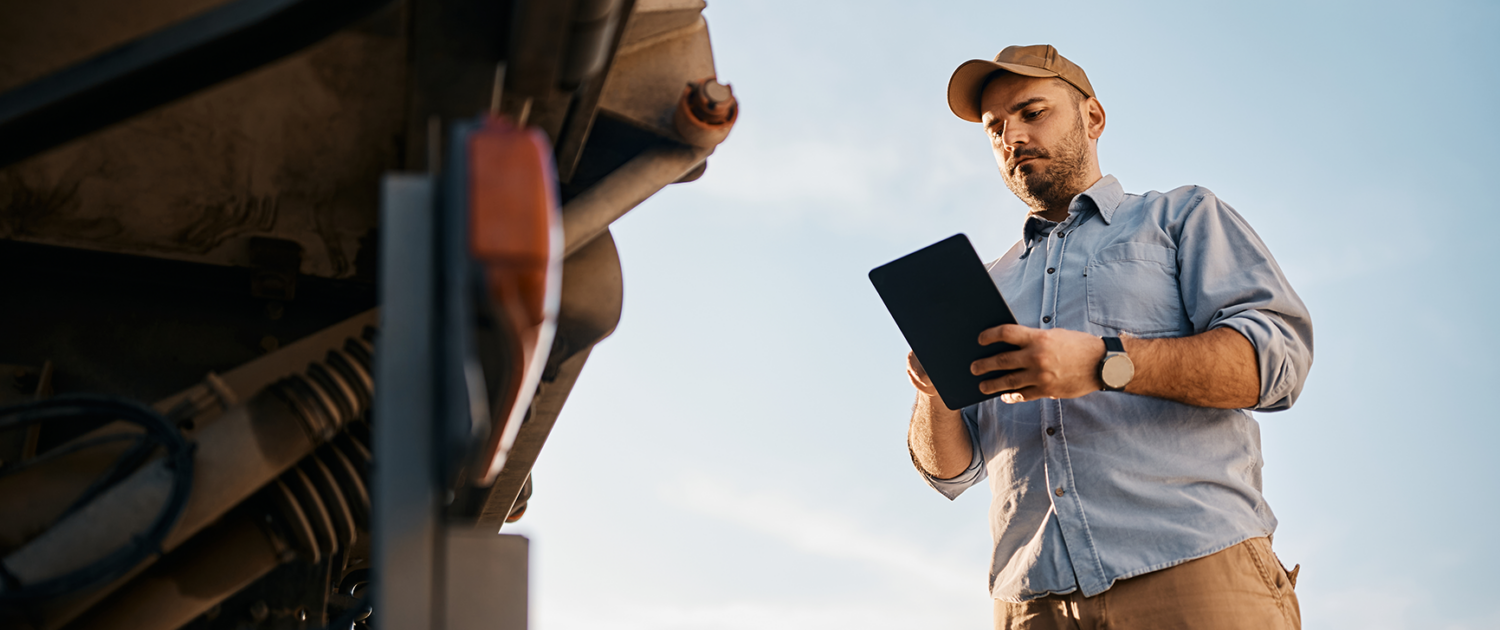 A CDL driver doing a pre-trip. inspection.