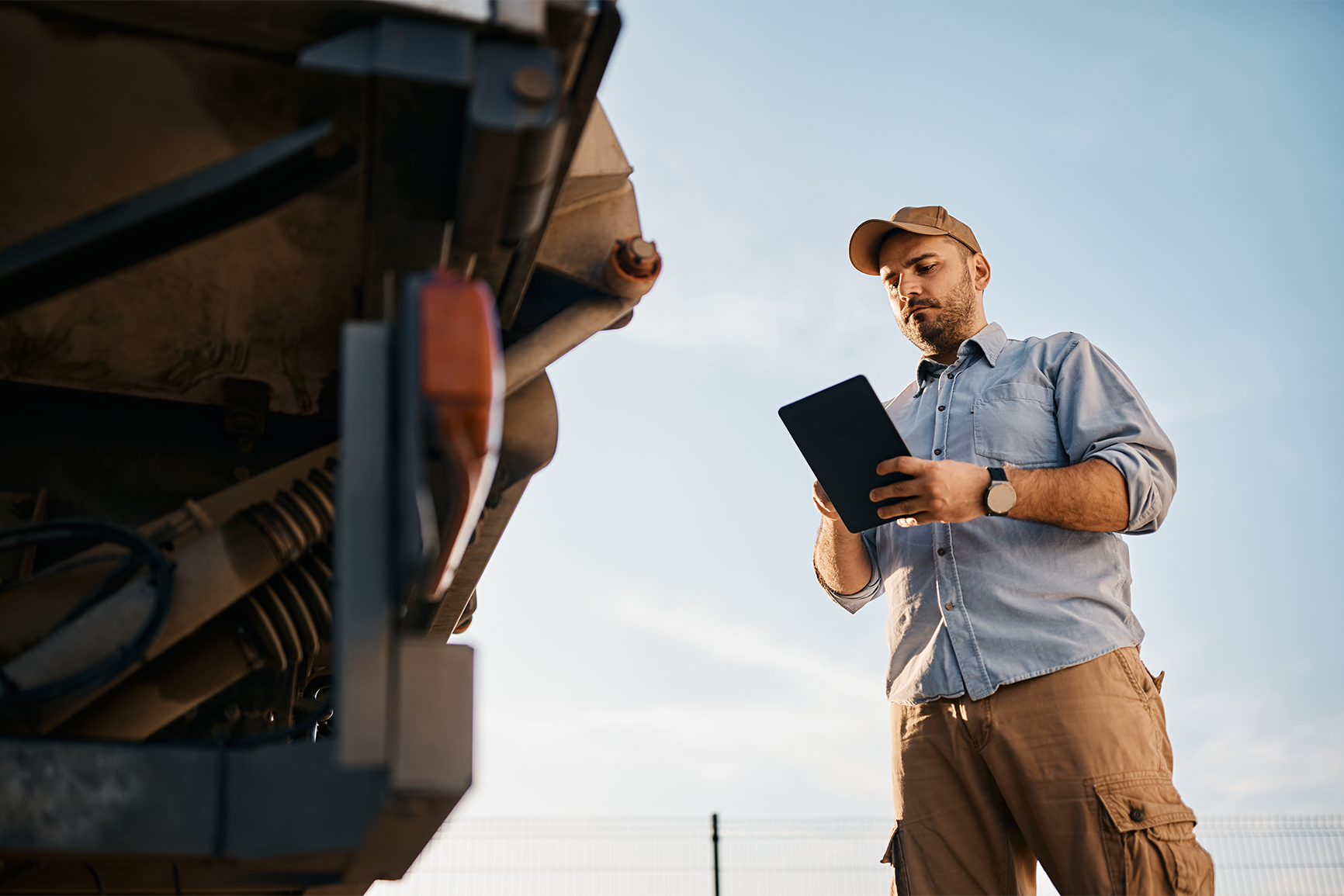 A CDL driver doing a pre-trip. inspection.