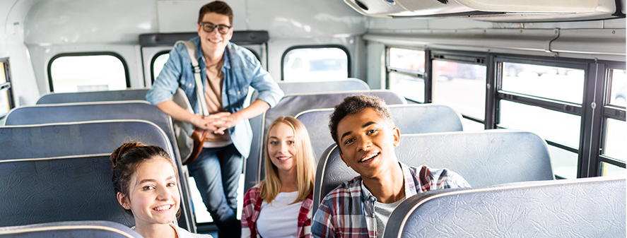 People sitting in a school bus.