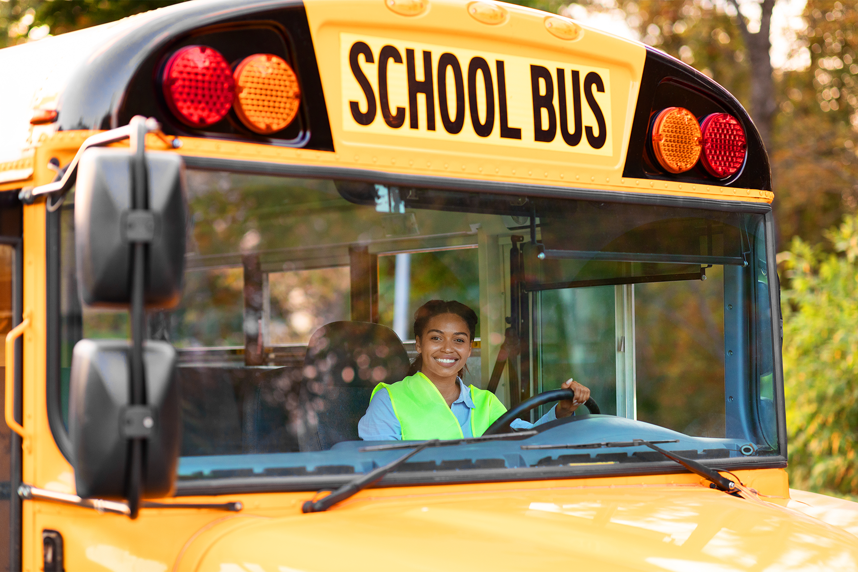 A person driving a school bus.